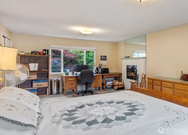 a bed room with furniture and a large window