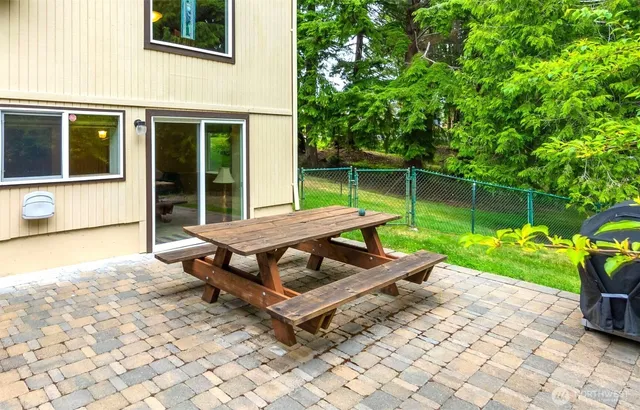 a wooden bench sitting in front of a building