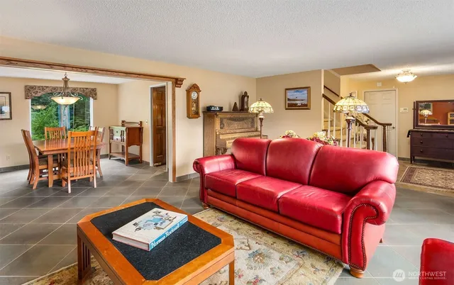 a living room with furniture and a table