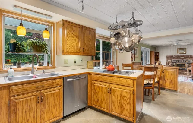 a kitchen with lots of counter top space and dining table