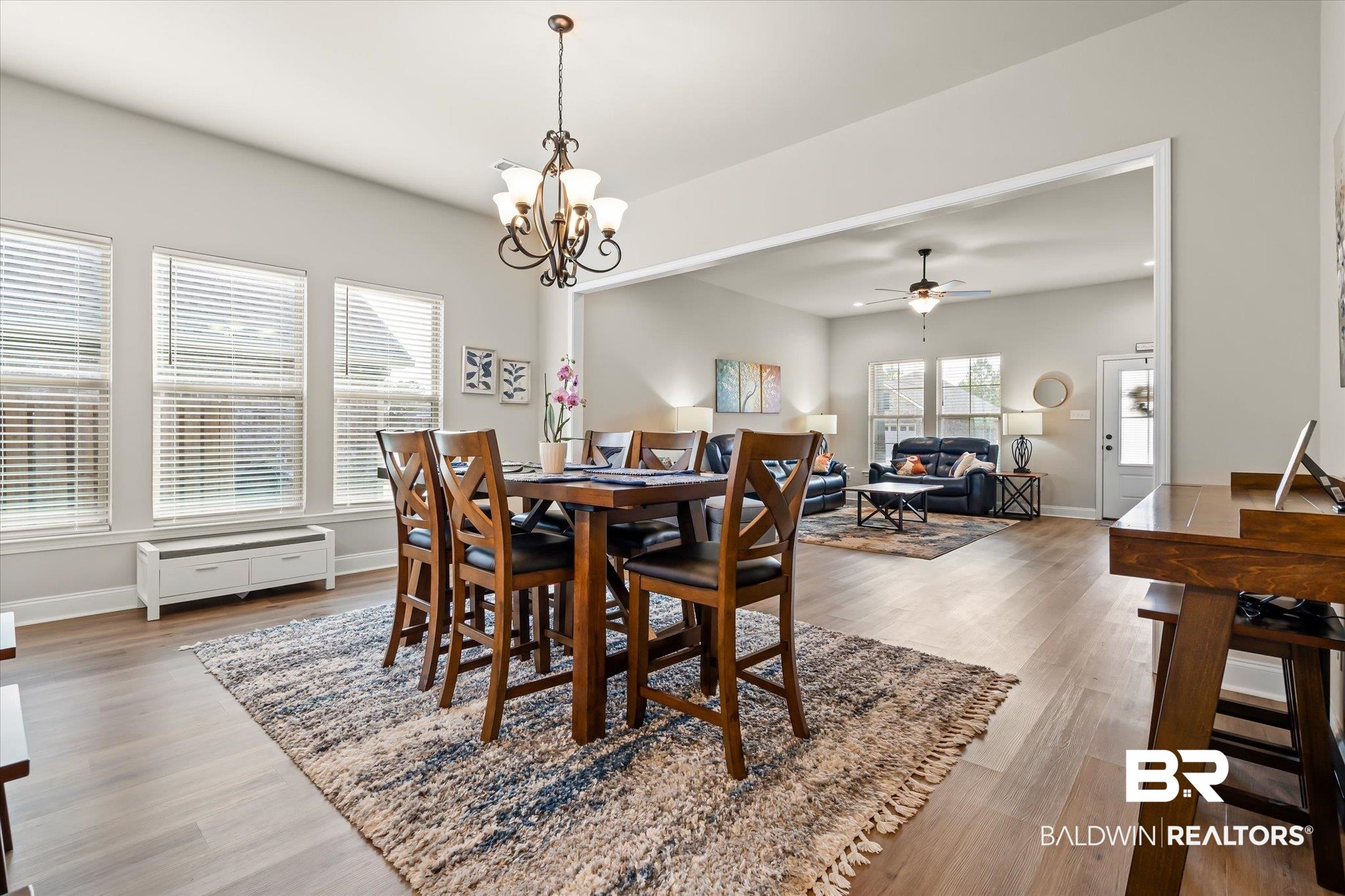 1116 Stella Road Foley, AL 36535 - Photo 8 of 29 Dining room featuring ceiling fan with notable chandelier and hardwood / wood-style flooring