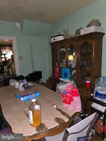 a kitchen with stainless steel appliances a refrigerator and a table