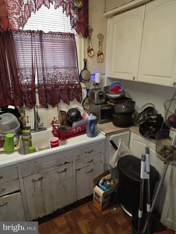 a kitchen with a stove and a sink