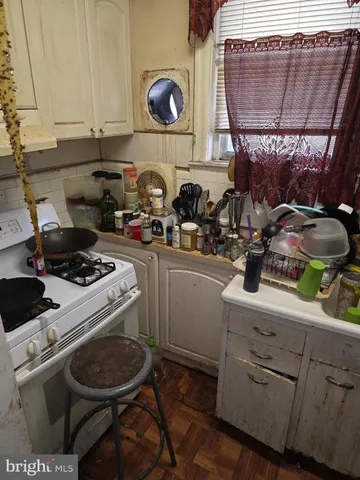 a room with furniture toys and a large window