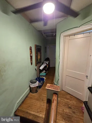 a view of entryway with wooden floor