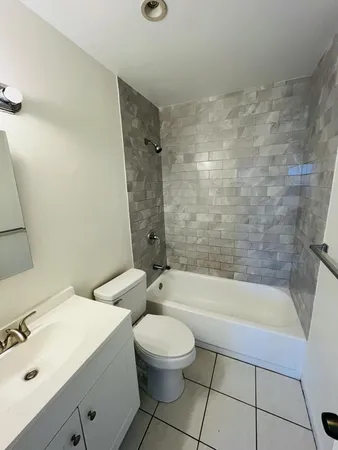 a bathroom with a sink a toilet and a bathtub