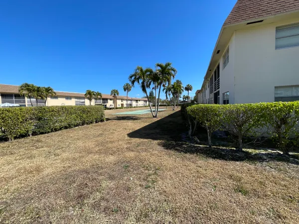 a view of a backyard of a house