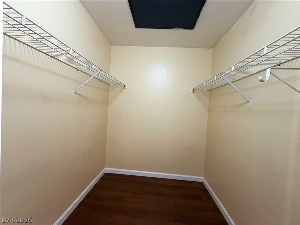 4955 South Lindell Road, Unit 203 Las Vegas, NV 89118 - Photo 20 of 31 Ample storage solutions elevate this functional walk-in closet.