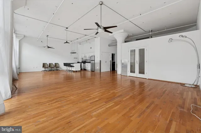a view of a room with wooden floor
