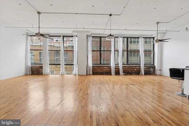 a view of a livingroom with wooden floor
