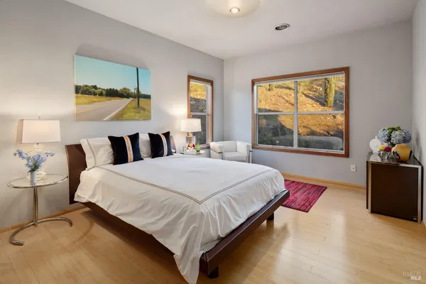 a bedroom with a bed and window