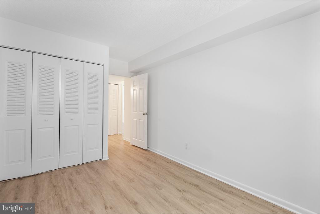 11600 Stoneview Square, Unit 60/2B Reston, VA 20191 - Photo 9 of 27 a view of an empty room with wooden floor
