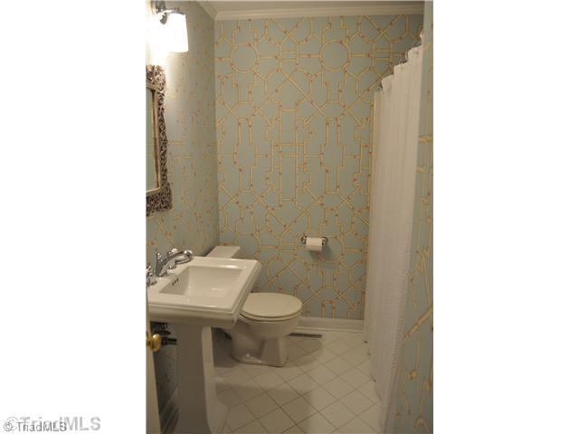 1611 Independence Road Greensboro, NC 27408 - Photo 8 of 14 Other Bath. Updated hall bath with new tile, sink, lighting and designer wallpaper