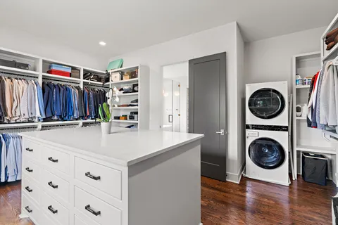 a bathroom with a double vanity sink mirror and a bathtub