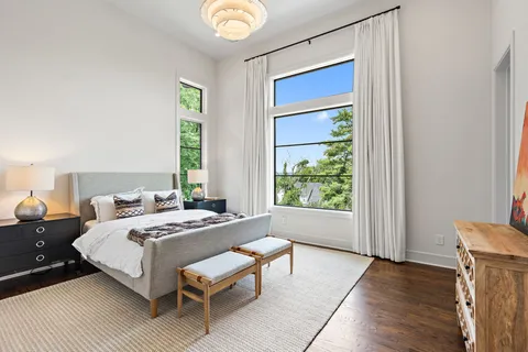 a bathroom with a double vanity sink toilet and shower
