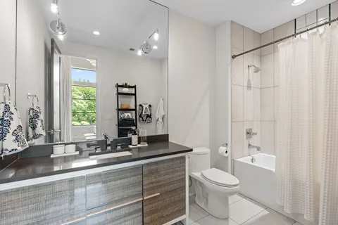 a bedroom with a bed and a couch