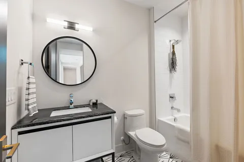 a work room with furniture and a window