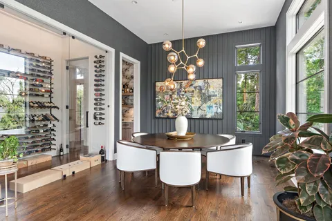 a kitchen with stainless steel appliances granite countertop a lot of counter top space and wooden floor