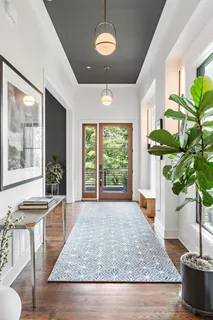 a kitchen with stainless steel appliances a sink stove and cabinets