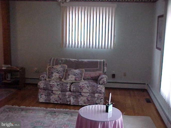 22118 Seldom Seen Road Southwest Lonaconing, MD 21539 - Photo 10 of 15 a living room with furniture and a large window