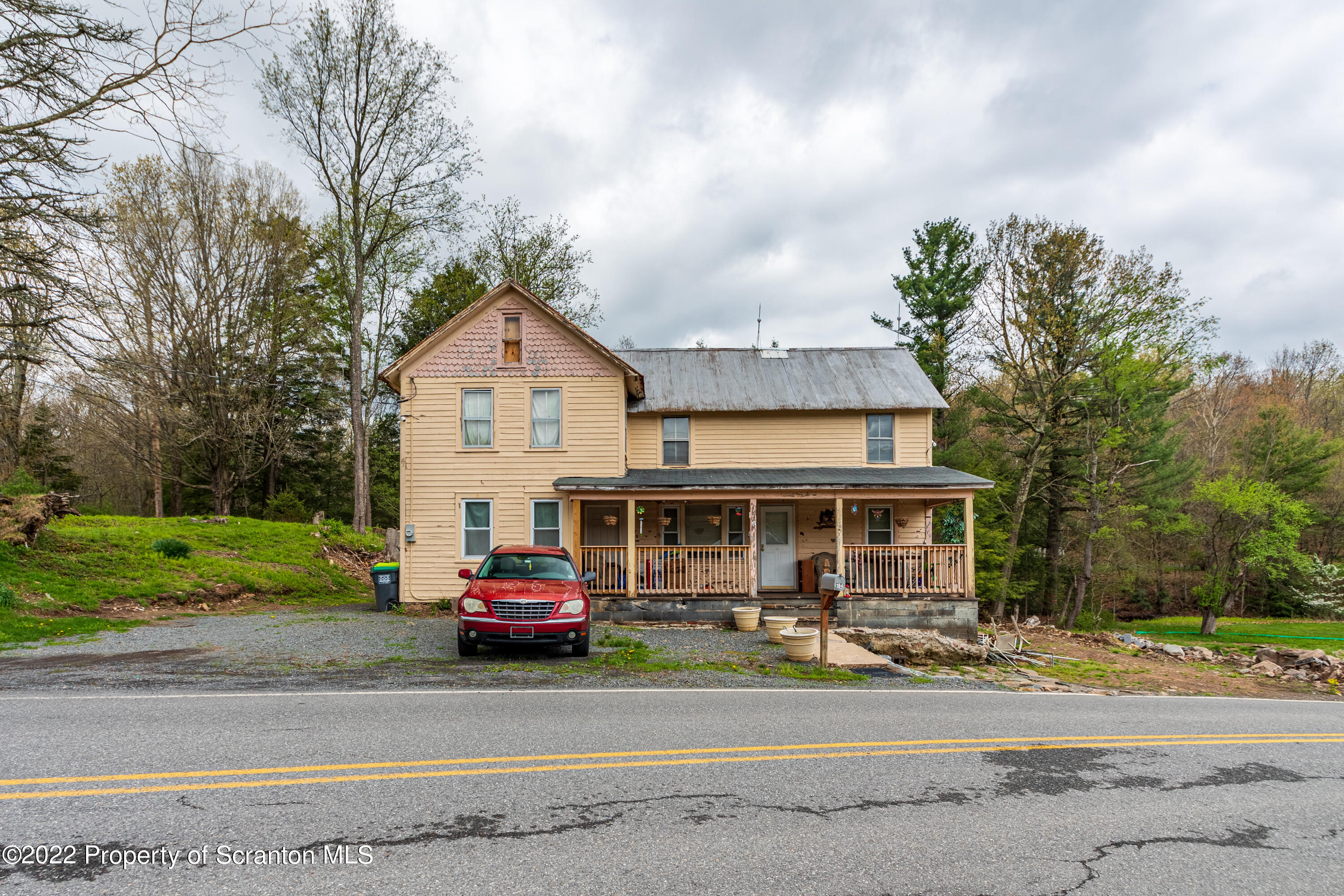 a car parked in front of a house