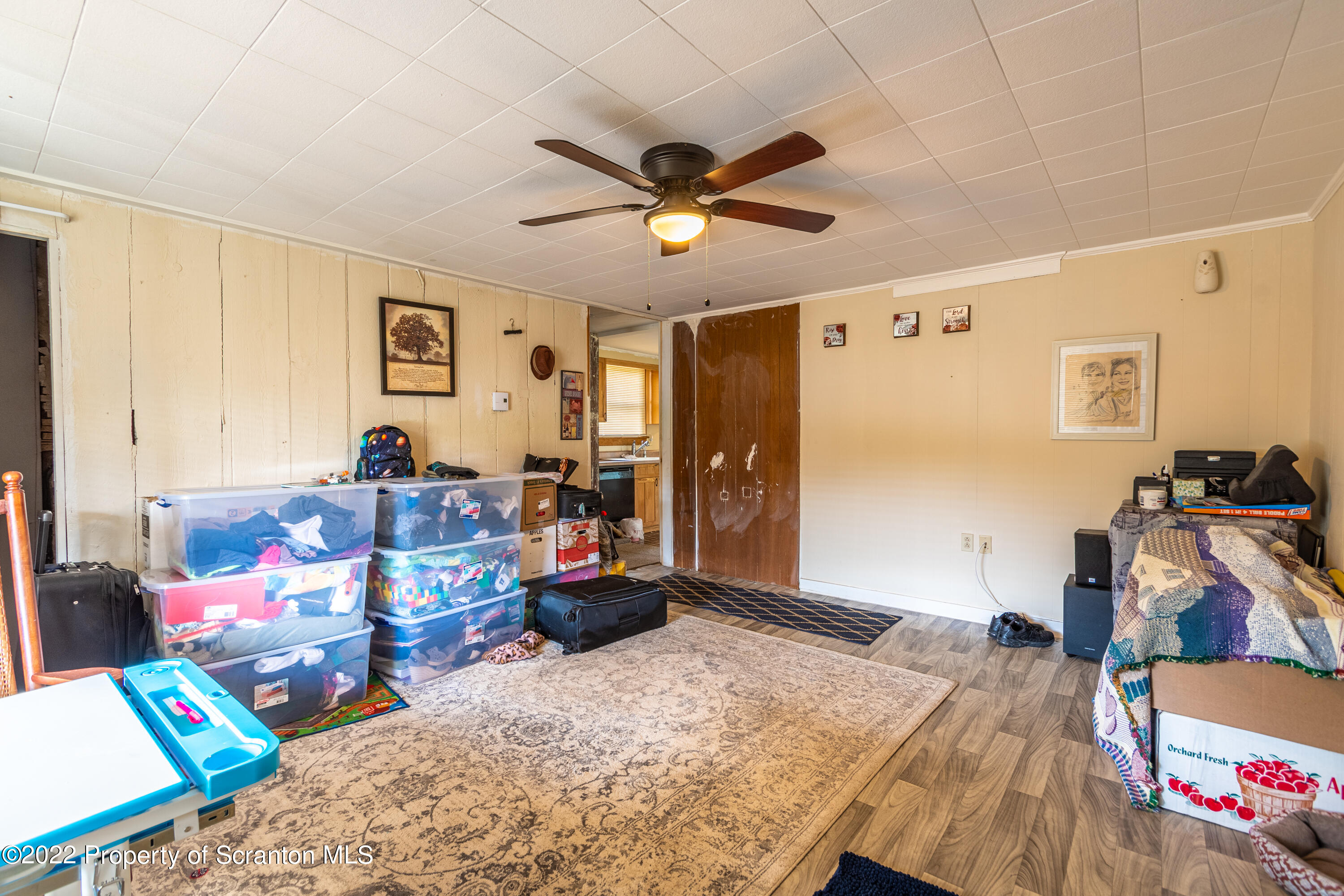 184 Crescent Lake Road Scotrun, PA 18355 - Photo 12 of 38 a bed room with furniture and a flat screen tv