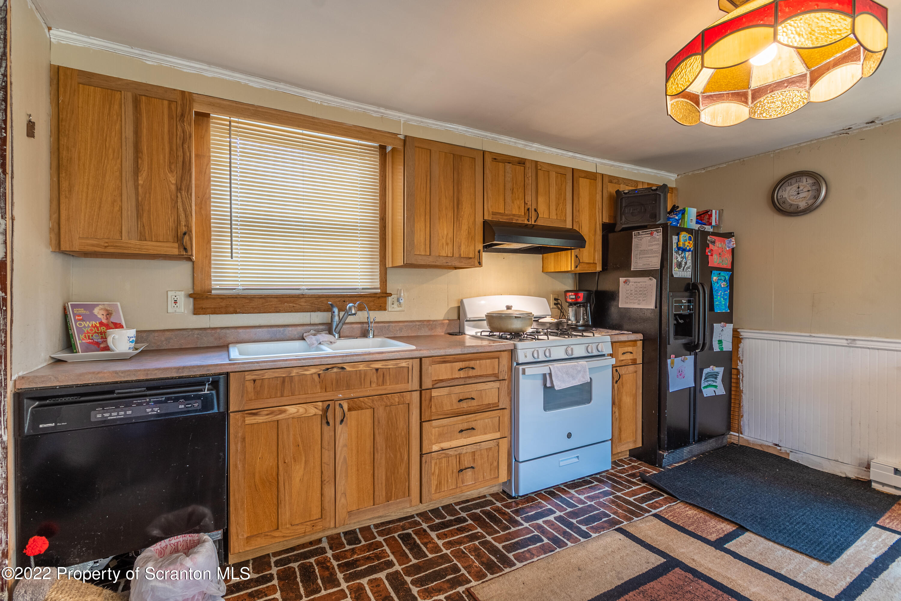 184 Crescent Lake Road Scotrun, PA 18355 - Photo 16 of 38 a kitchen with a sink cabinets and window