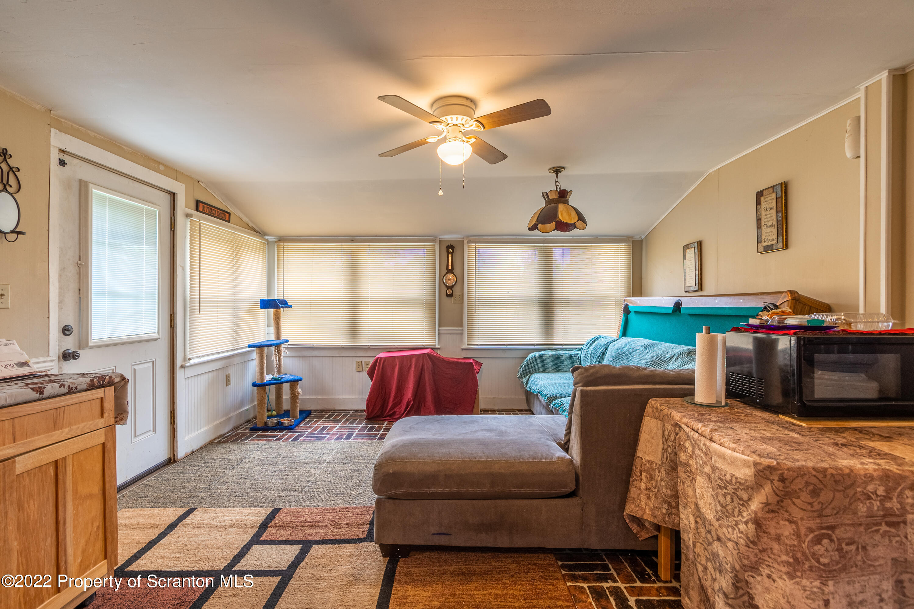 184 Crescent Lake Road Scotrun, PA 18355 - Photo 17 of 38 a living room with furniture and a large window