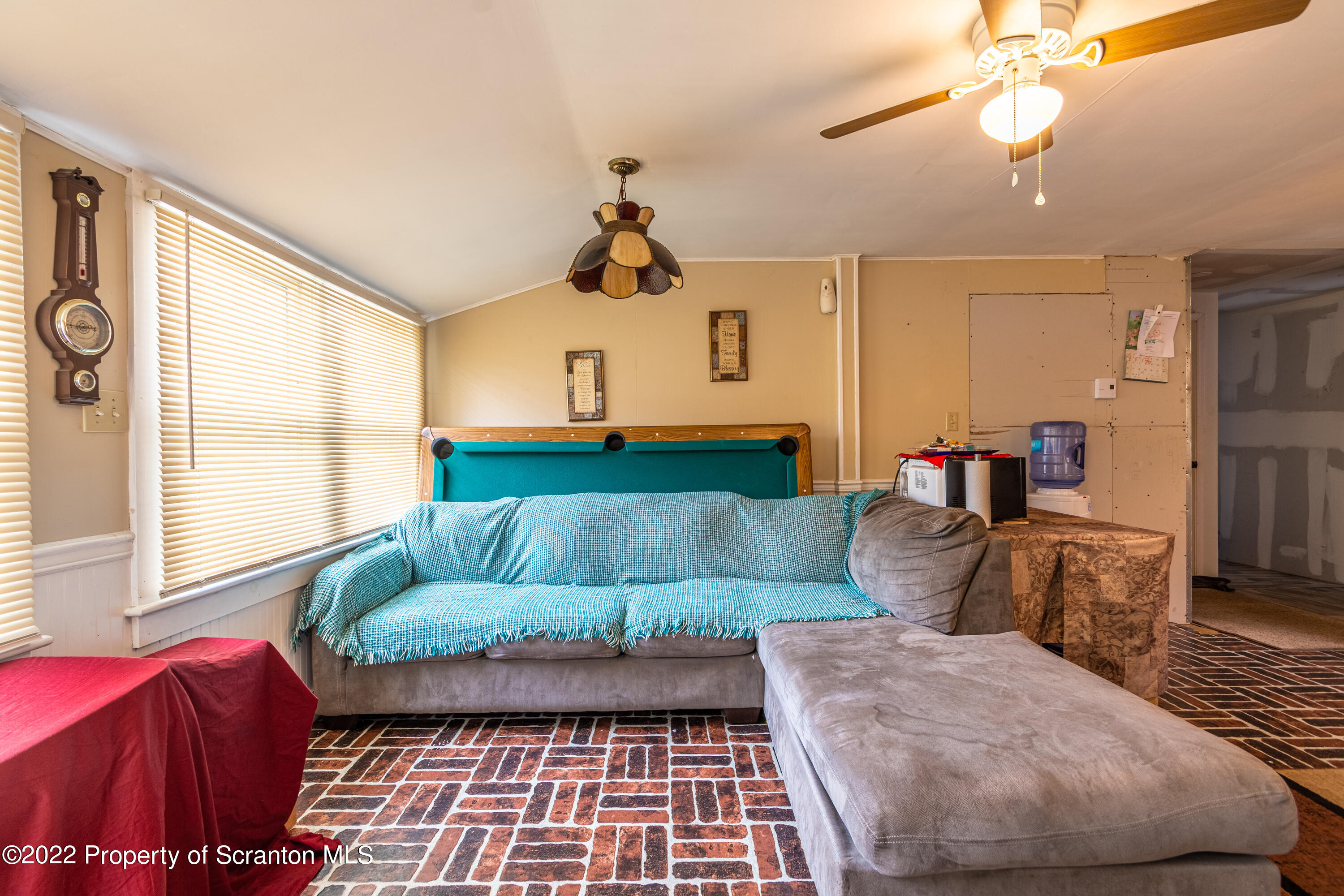 184 Crescent Lake Road Scotrun, PA 18355 - Photo 18 of 38 a living room with furniture and a large window
