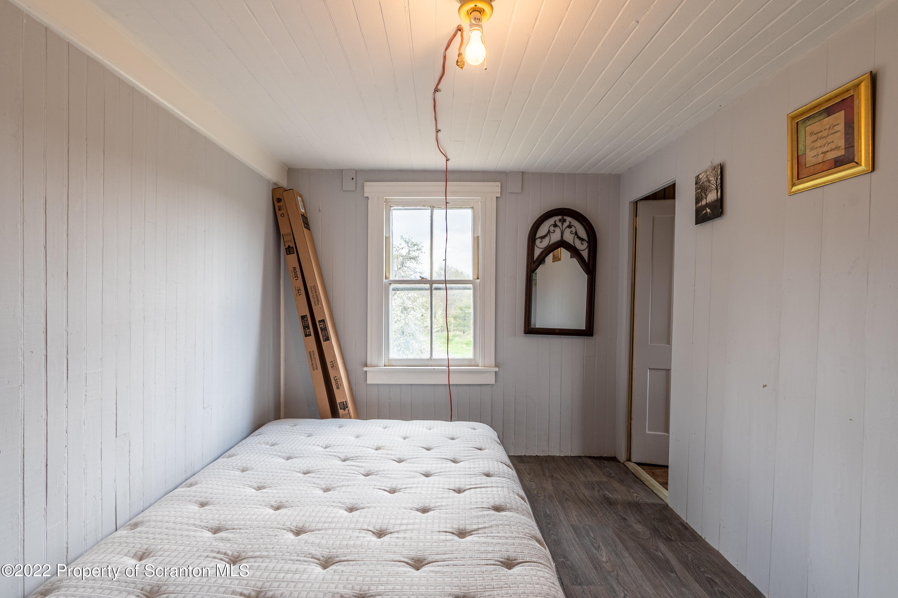184 Crescent Lake Road Scotrun, PA 18355 - Photo 25 of 38 a bedroom with a bed and a window