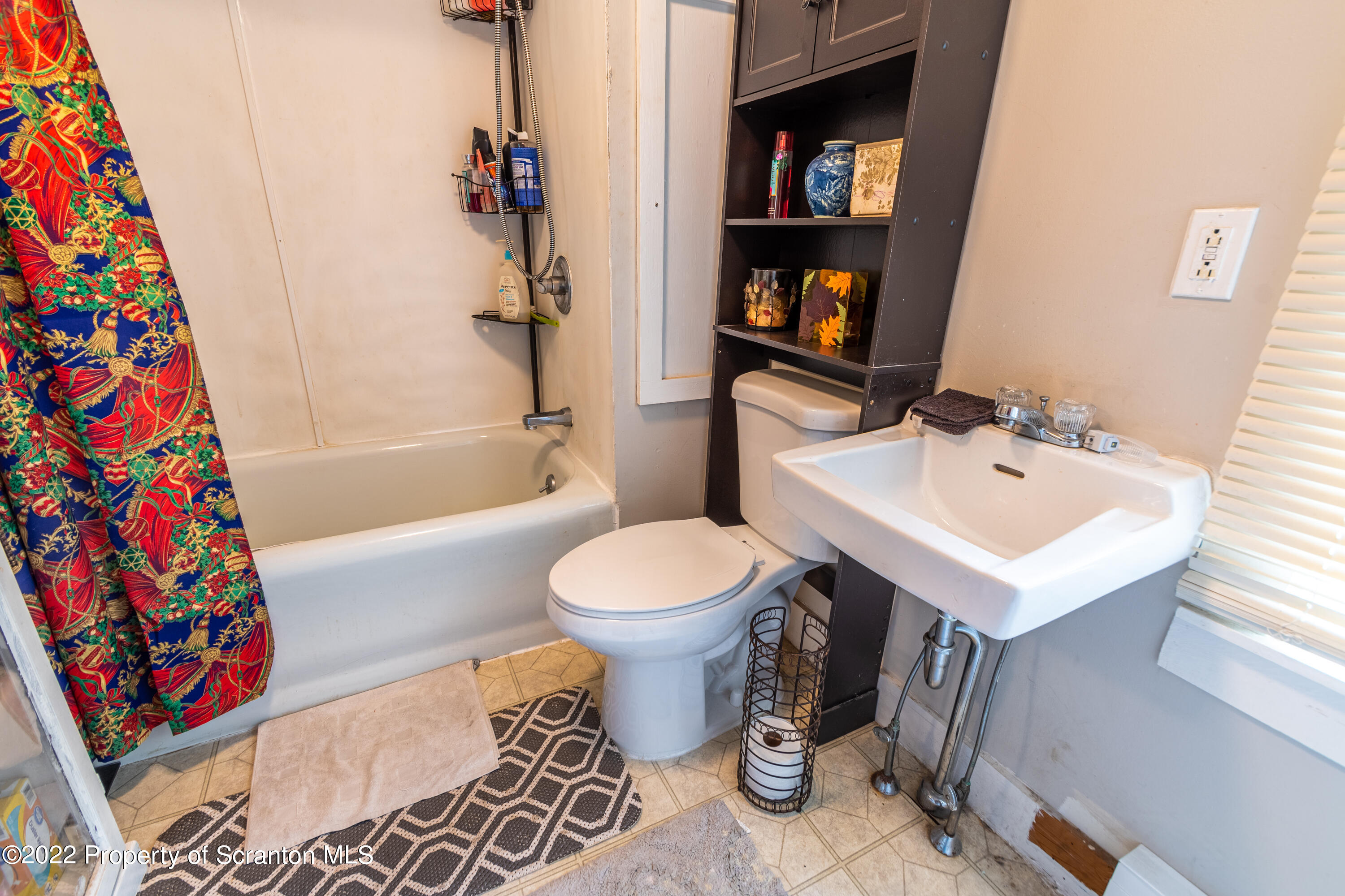 184 Crescent Lake Road Scotrun, PA 18355 - Photo 36 of 38 a bathroom with a sink toilet and shower