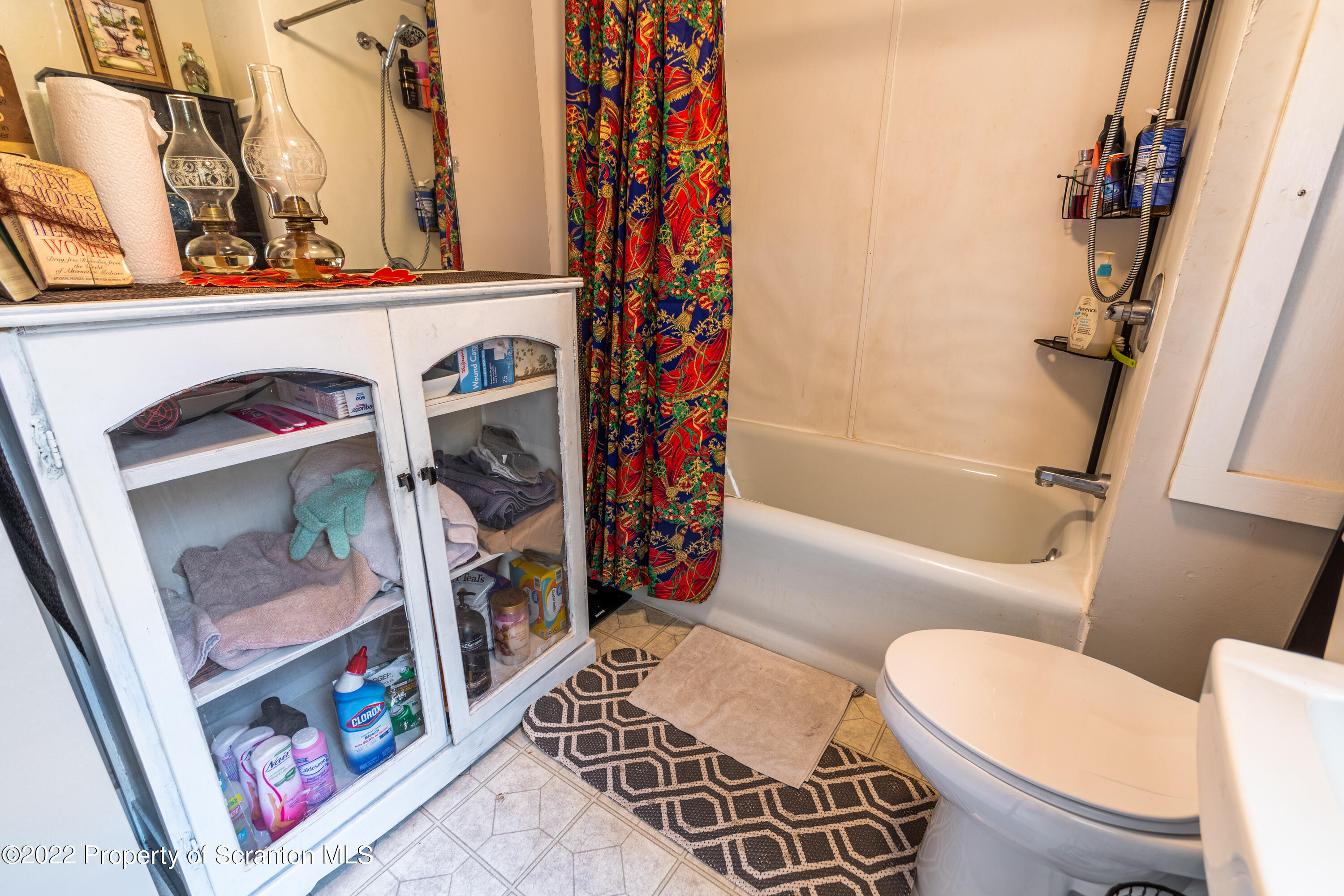 184 Crescent Lake Road Scotrun, PA 18355 - Photo 38 of 38 a bathroom with a toilet and a shower curtain