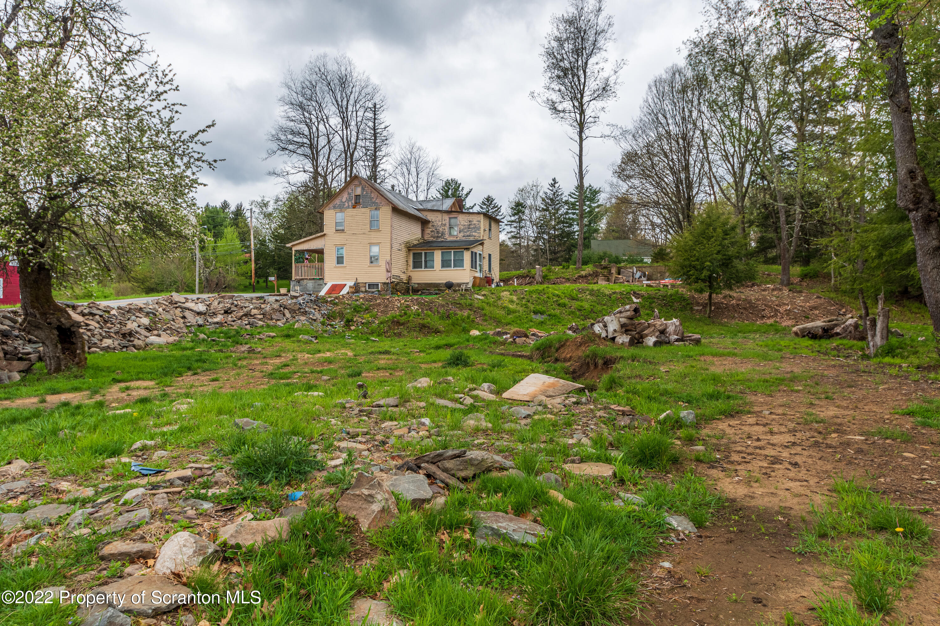184 Crescent Lake Road Scotrun, PA 18355 - Photo 6 of 38 a front view of a house with a yard