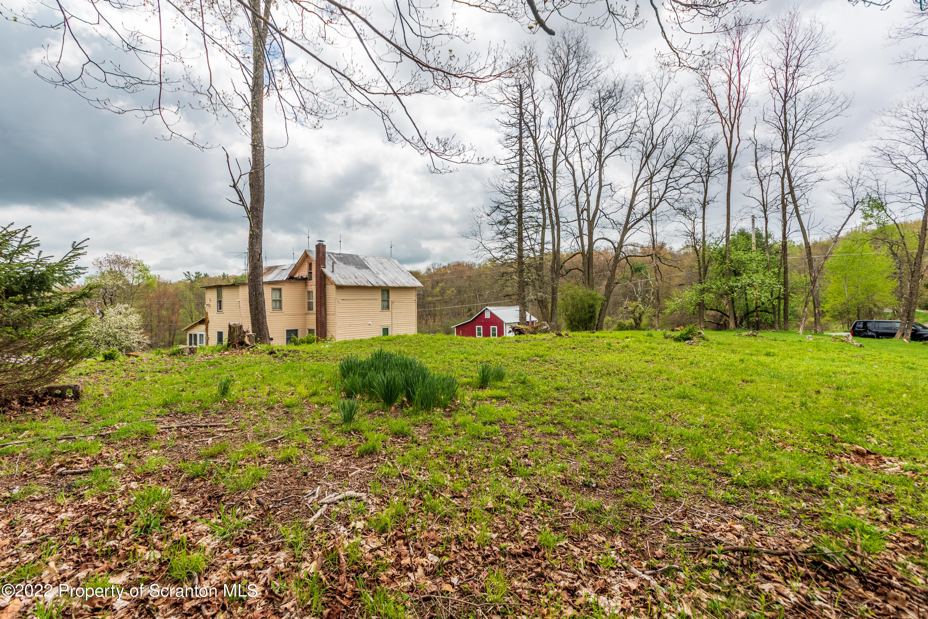 184 Crescent Lake Road Scotrun, PA 18355 - Photo 7 of 38 a view of a garden with trees