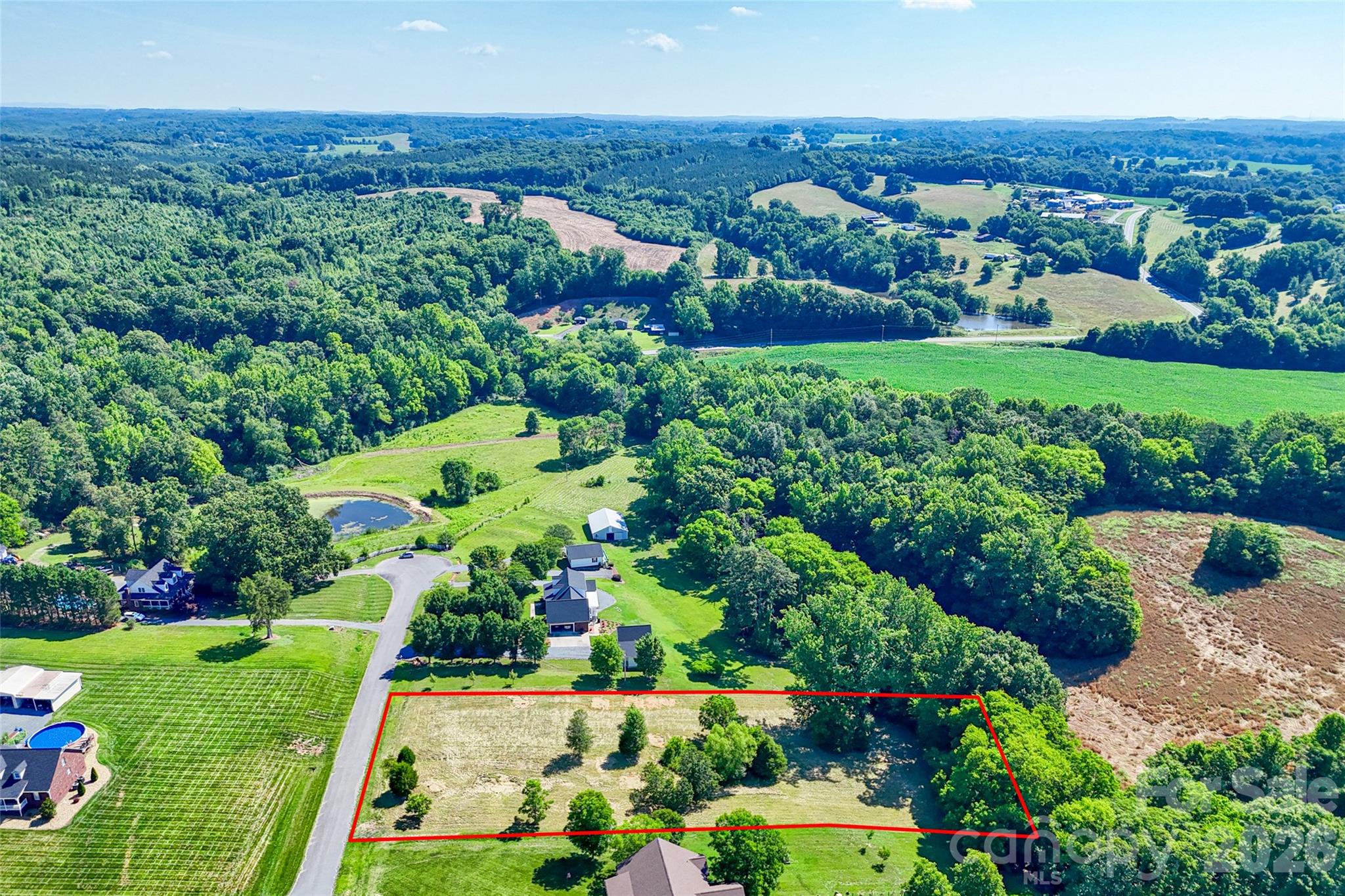 Lot 3 Crepts Branch Road, Unit 3 Locust, NC 28097 - Photo 25 of 36 an aerial view of green landscape with trees houses and mountain view