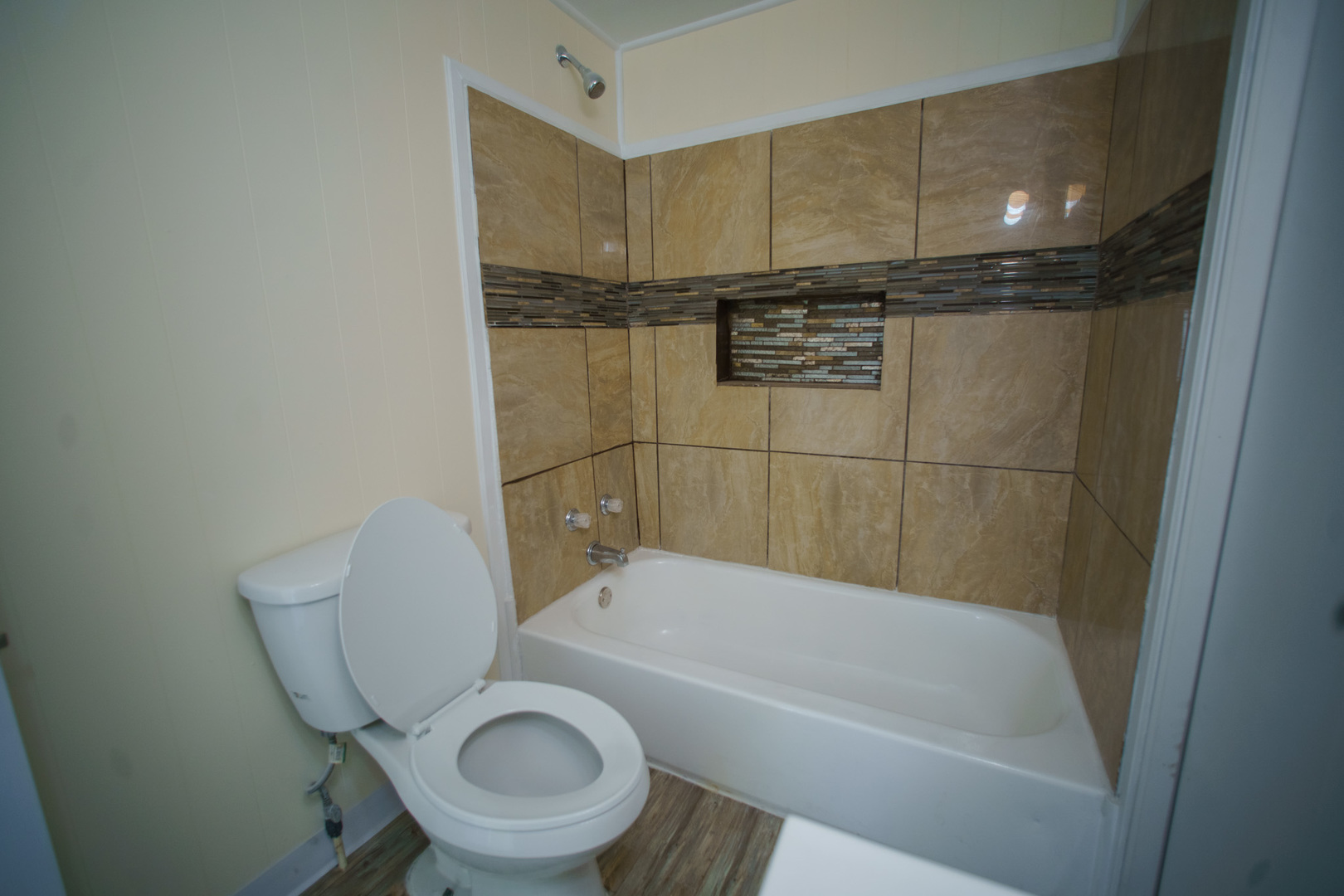 123 Errett Road Rochelle, IL 61068 - Photo 8 of 18 a bathroom with a granite countertop bathtub shower sink vanity and toilet