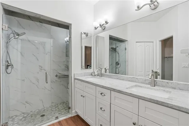 a bathroom with a granite countertop sink a toilet and a mirror