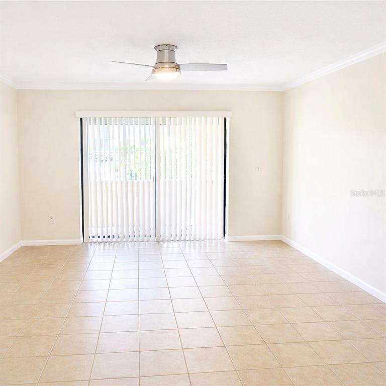5273 Vineland Road, Unit 103 Orlando, FL 32811 - Photo 3 of 8 a view of an empty room with a window