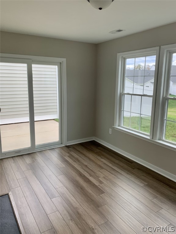 76 Wendenburg Way Aylett, VA 23009 - Photo 14 of 23 an empty room with wooden floor and windows