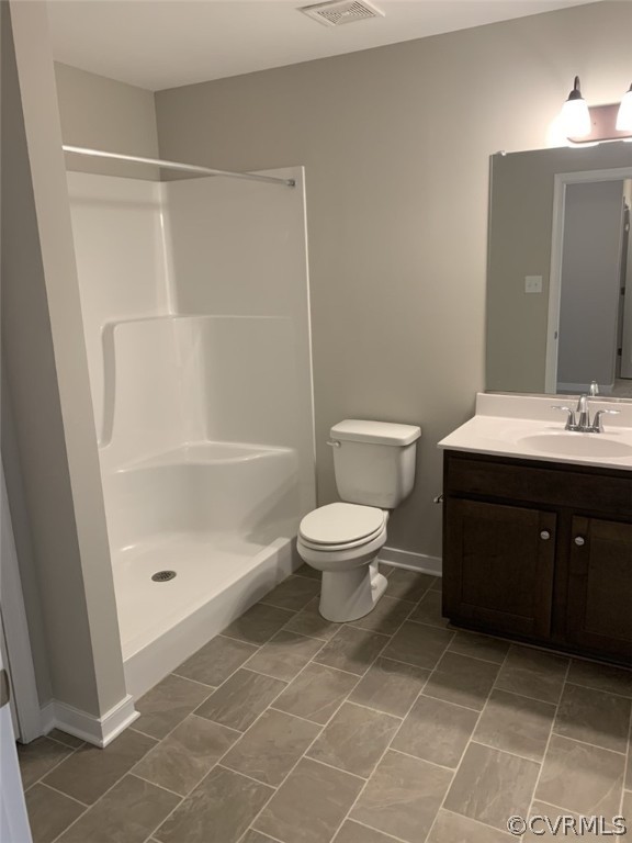 76 Wendenburg Way Aylett, VA 23009 - Photo 21 of 23 a spacious bathroom with a double vanity sink toilet and shower