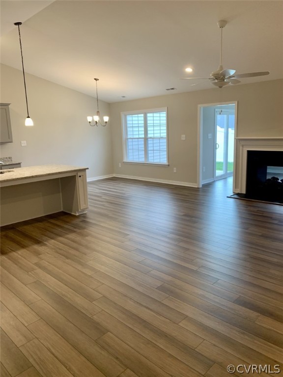 76 Wendenburg Way Aylett, VA 23009 - Photo 6 of 23 a view of a room with wooden floor and fireplace