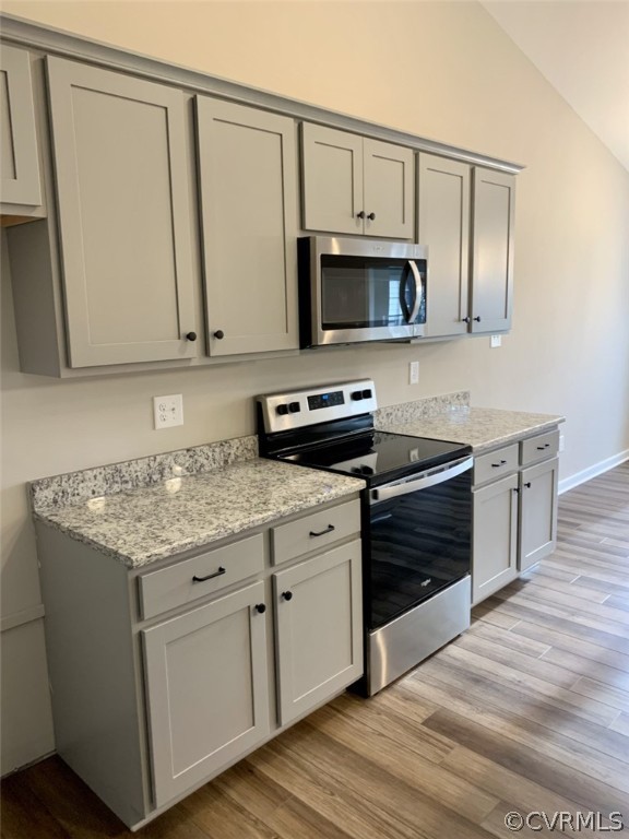 76 Wendenburg Way Aylett, VA 23009 - Photo 8 of 23 a kitchen with stainless steel appliances granite countertop a stove a sink and a microwave