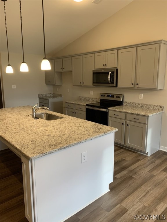 76 Wendenburg Way Aylett, VA 23009 - Photo 9 of 23 a kitchen with stainless steel appliances granite countertop a sink a stove and a microwave