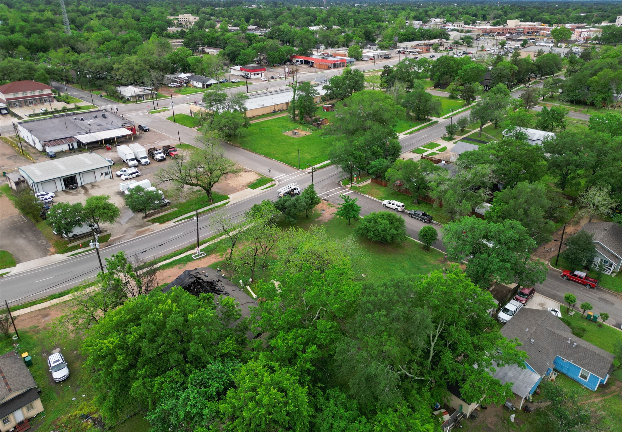 406 East Phillips Street Conroe, TX 77301 - Photo 12 of 20 an aerial view of residential houses with outdoor space and street view