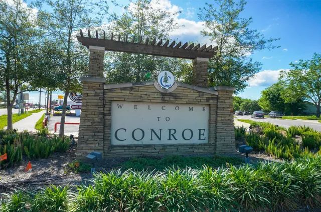 a view of outdoor space with sign board and garden