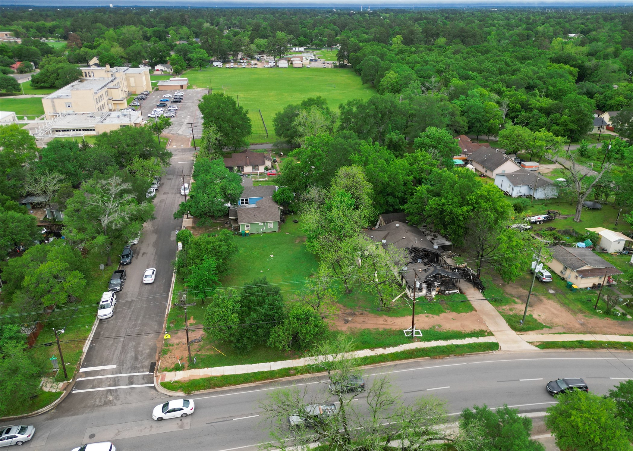 406 East Phillips Street Conroe, TX 77301 - Photo 6 of 20 an aerial view of residential houses with outdoor space and street view