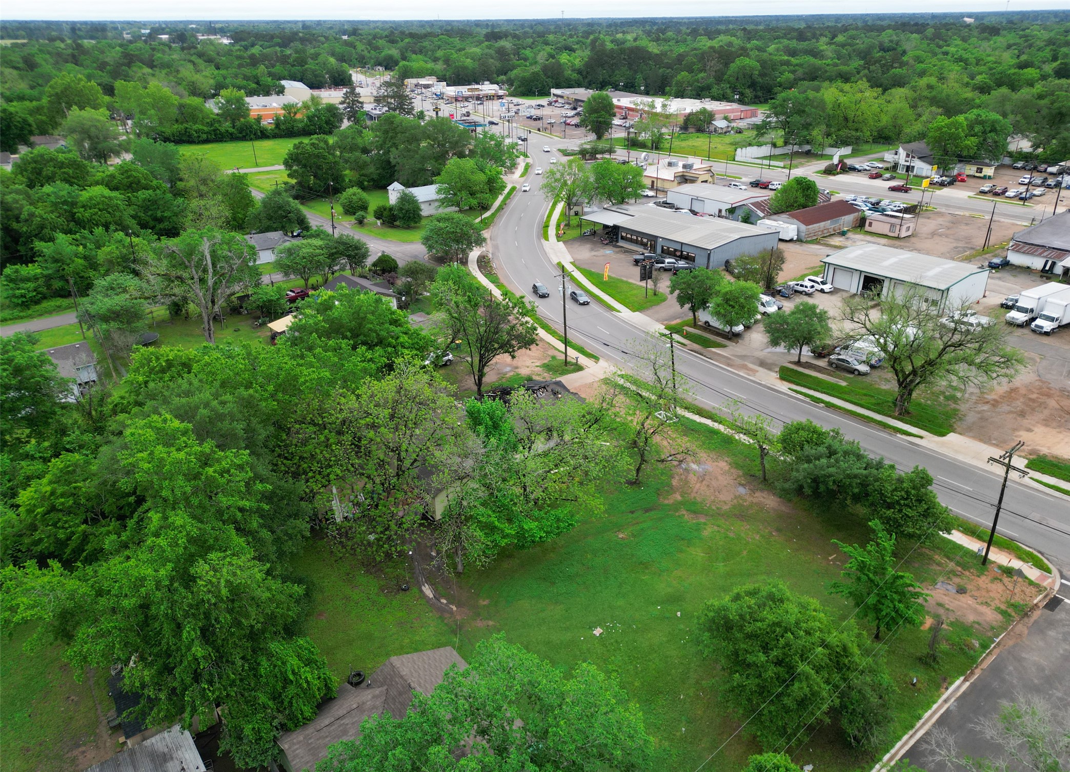 406 East Phillips Street Conroe, TX 77301 - Photo 10 of 20 an aerial view of residential houses with outdoor space and trees