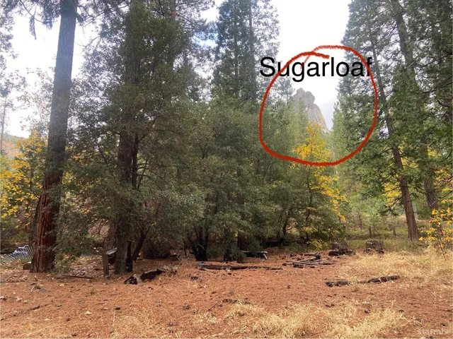 a sign that is sitting on a rock