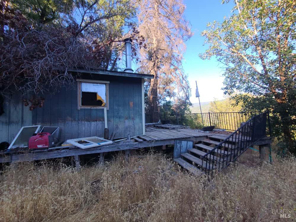 28990 Eel River Ranch Road Covelo, CA 95428 - Photo 11 of 31 a view of house with backyard and seating area