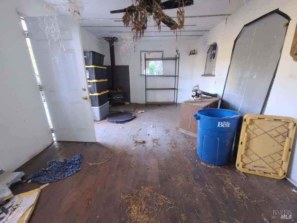 28990 Eel River Ranch Road Covelo, CA 95428 - Photo 15 of 31 a living room with furniture and a fireplace